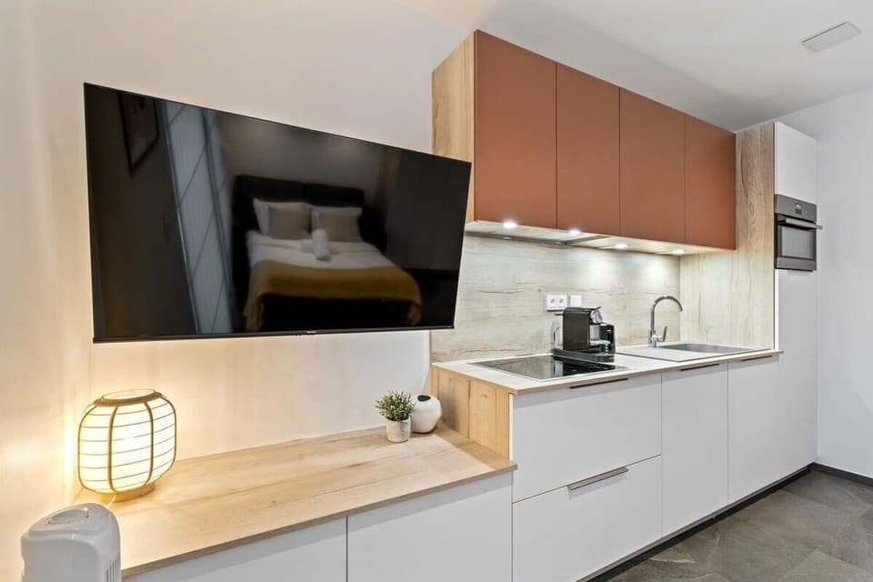 Modern kitchen with all you need, plus a TV to keep you entertained while you cook.