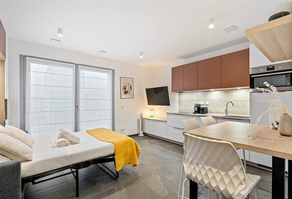 A modern kitchen to inspire your culinary creativity, complete with cozy dining space.