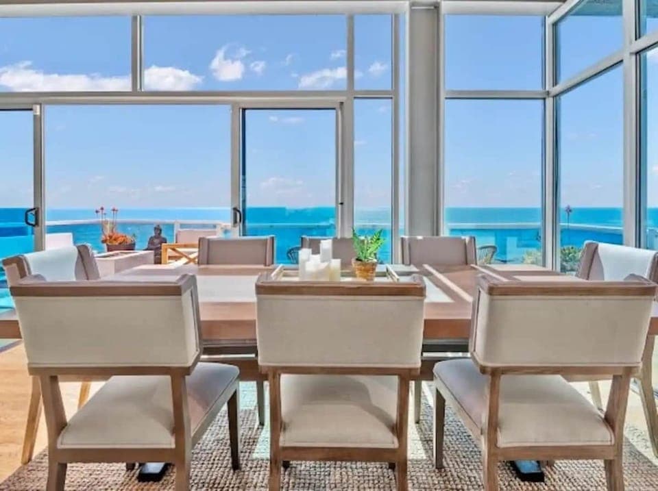 Watch surfers catch epic waves with breathtaking ocean views, all while enjoying the pleasure of a perfect meal in this coastal paradise. 