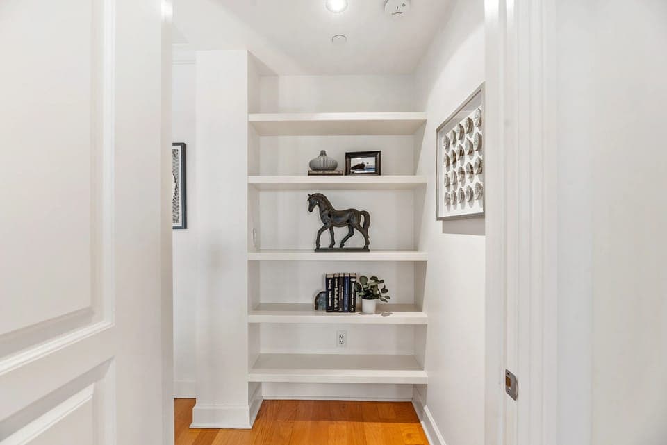 Hallway nook with built-in shelving and décor accents
