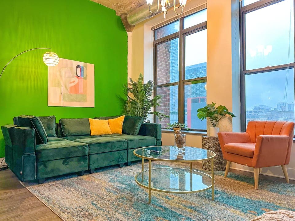 Spacious living room with a lot of natural light and large windows.