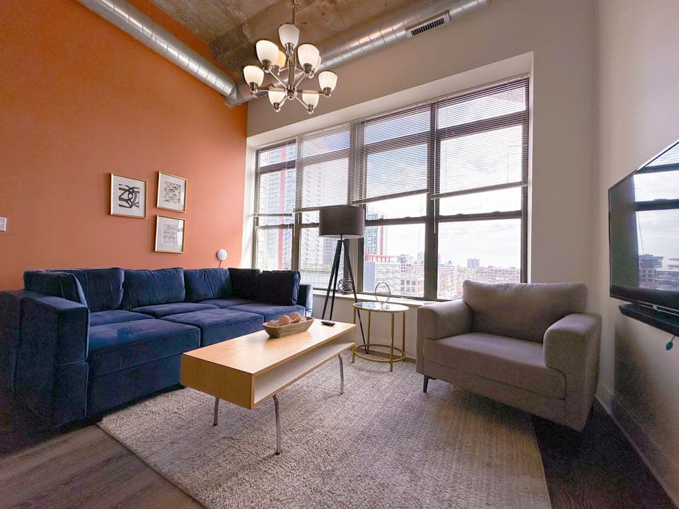 Spacious living room with a lot of natural light and large windows