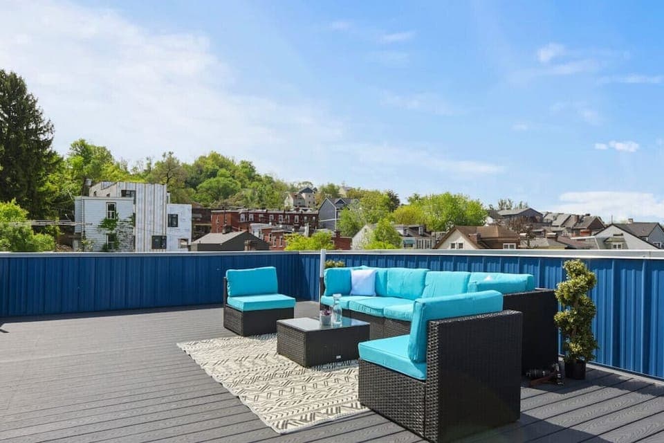 Rooftop deck with skyline views & lounge seating — a guest favorite
