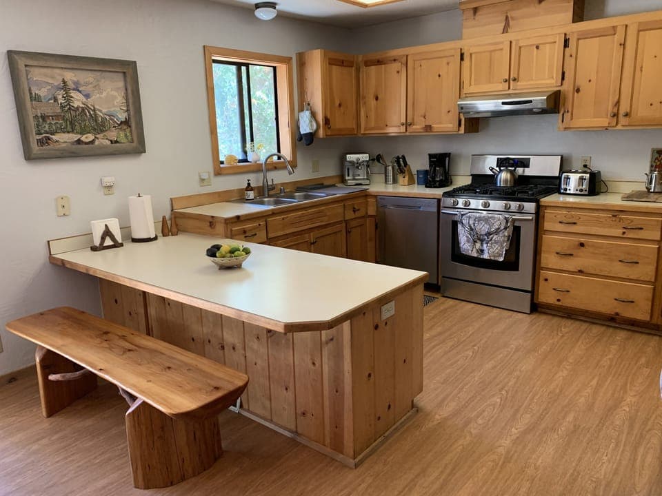 Fully equipped kitchen with dining bench
