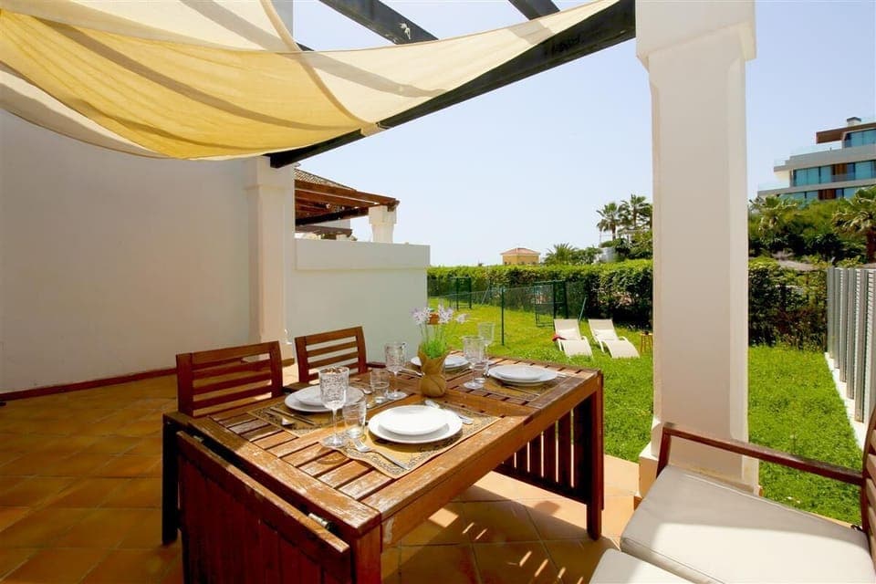 Beautiful private terrace with outdoor dining area and private garden