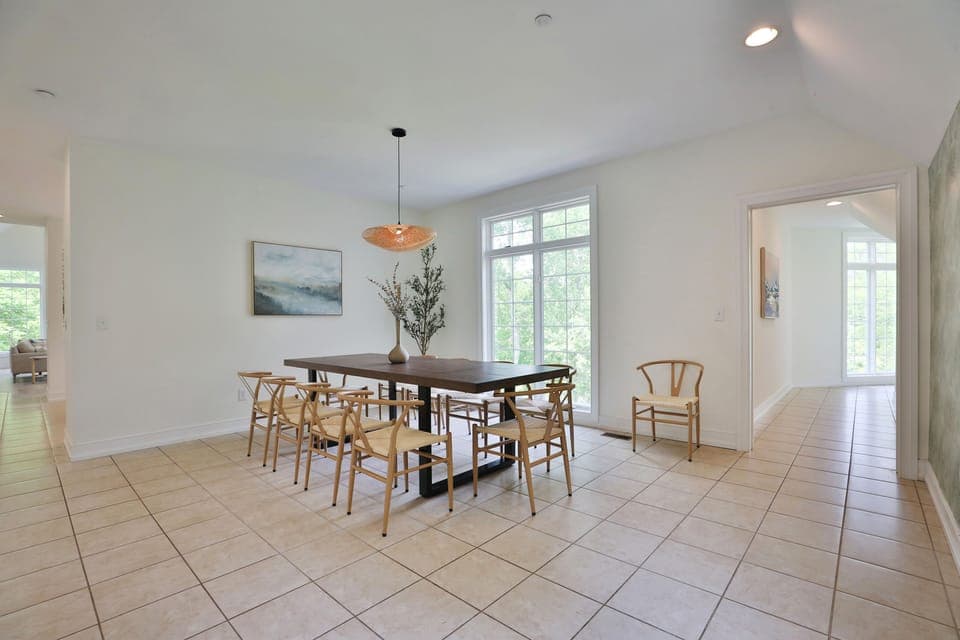 Formal dining room with large table. Addtl folding tables and chairs on property