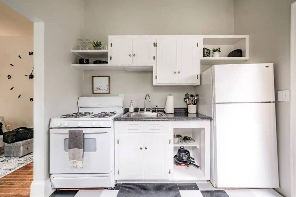 Full kitchen includes gas stove, oven, microwave, sink, dishware, pots/pans, and everything you need for cooking basic meals.