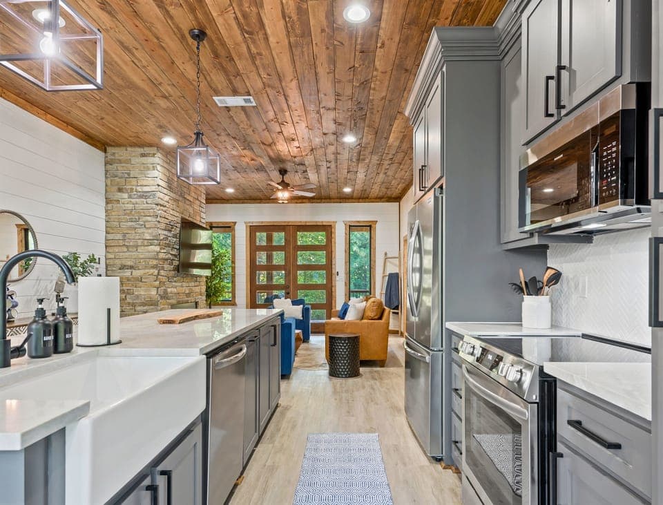 Stainless steel appliances and a large island make meal prep in this kitchen both efficient and enjoyable.