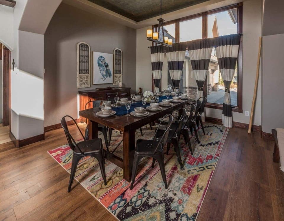 Seating for 10 at the dining table with additional seating for 4 at the bar. 