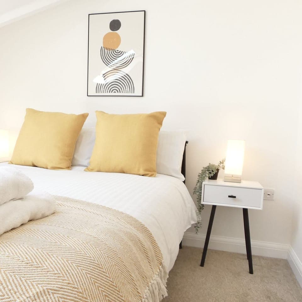 The overall design of the bedroom features a harmonious color scheme, creating a visually pleasing and tranquil environment.