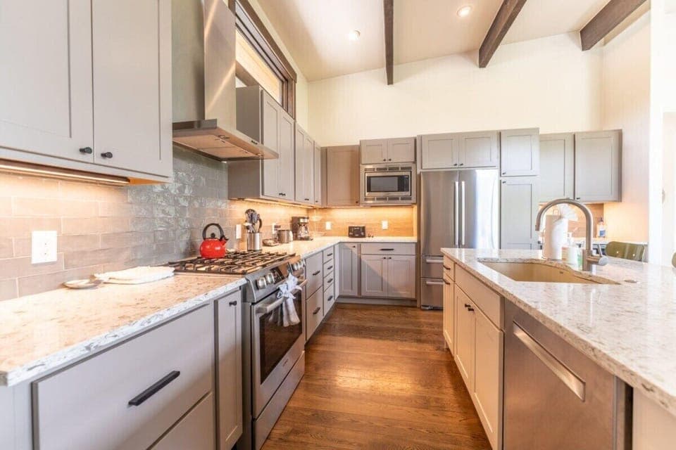 Kitchen stocked with appliances, pots and pans to cook for a large group