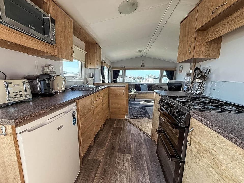 Compact yet equipped open caravan kitchen for all of your culinary needs.