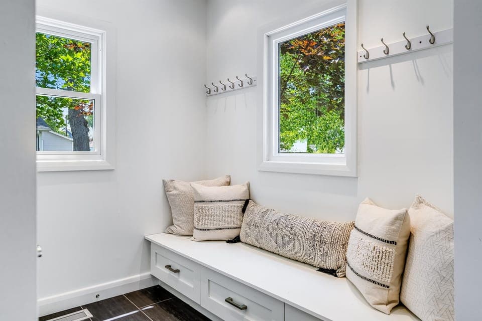 Functional mudroom with built-in seating & ample hooks for your essentials.