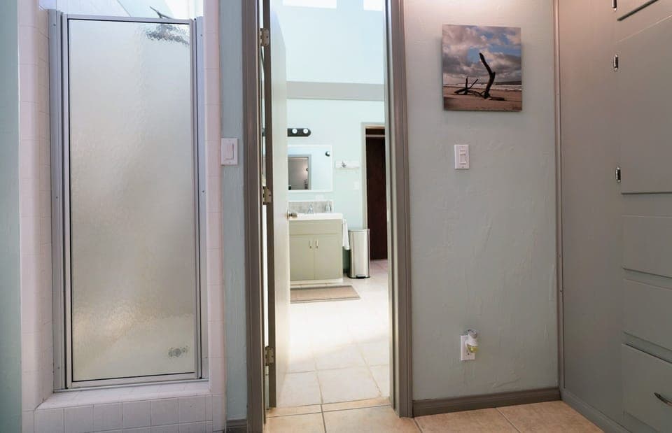 Shower with a fixed showerhead or taller shower/wand option for flexibility.