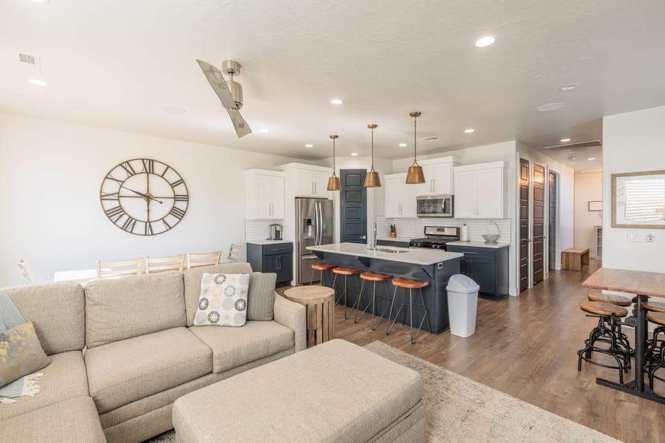 Living Room View - The living room is designed as an open floor plan and is a great gathering place for meals, games, or watching TV during your stay.