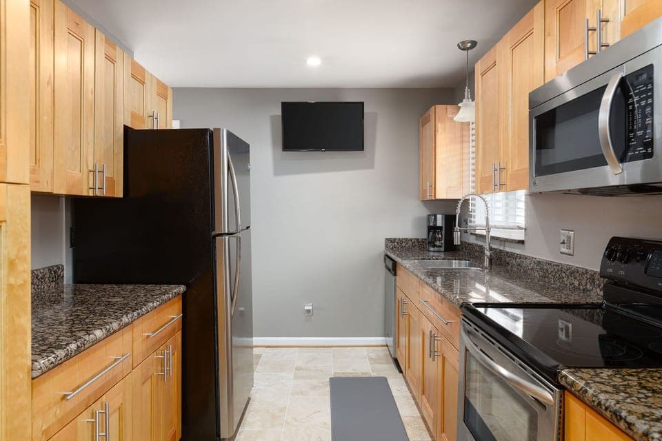 Fully stocked kitchen with smart tv to stream your favorite shows while you cook