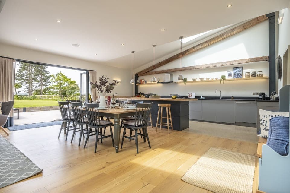 Fitters Barn, Warham: Contemporary kitchen with dining table and great access to the garden