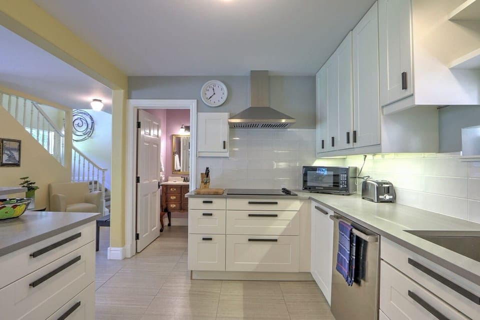 Modern kitchen with sleek counters and new stainless appliances