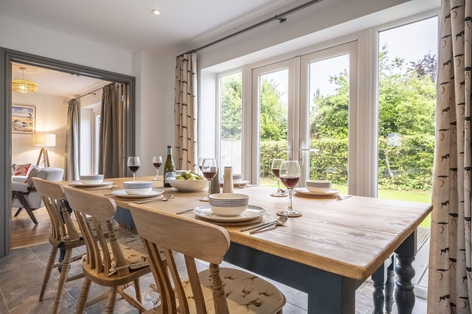 Ground floor: Dining area beside doors to the garden