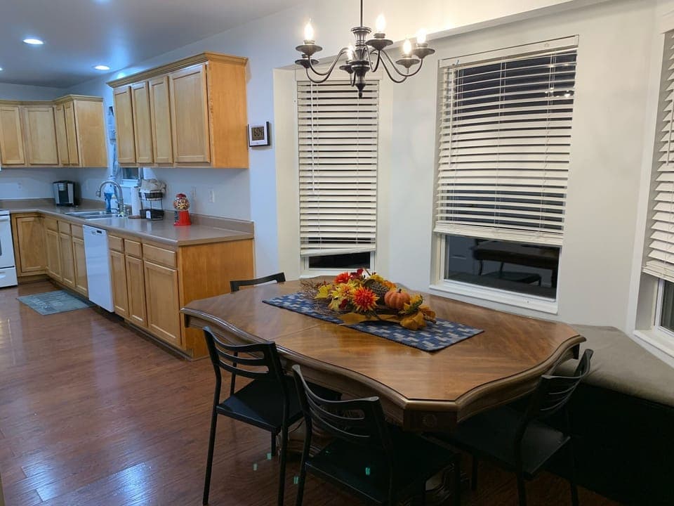 The galley style kitchen has a kitchen table with window seat on one side