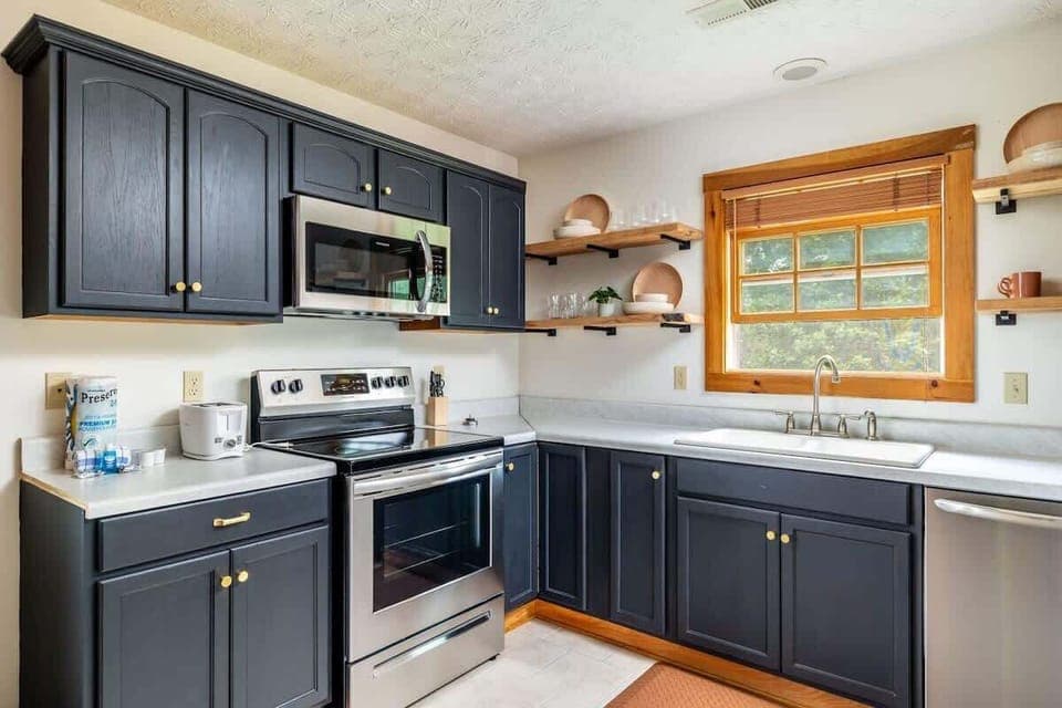 Modern appliances and rustic shelves make cooking a delight in Sevierville!