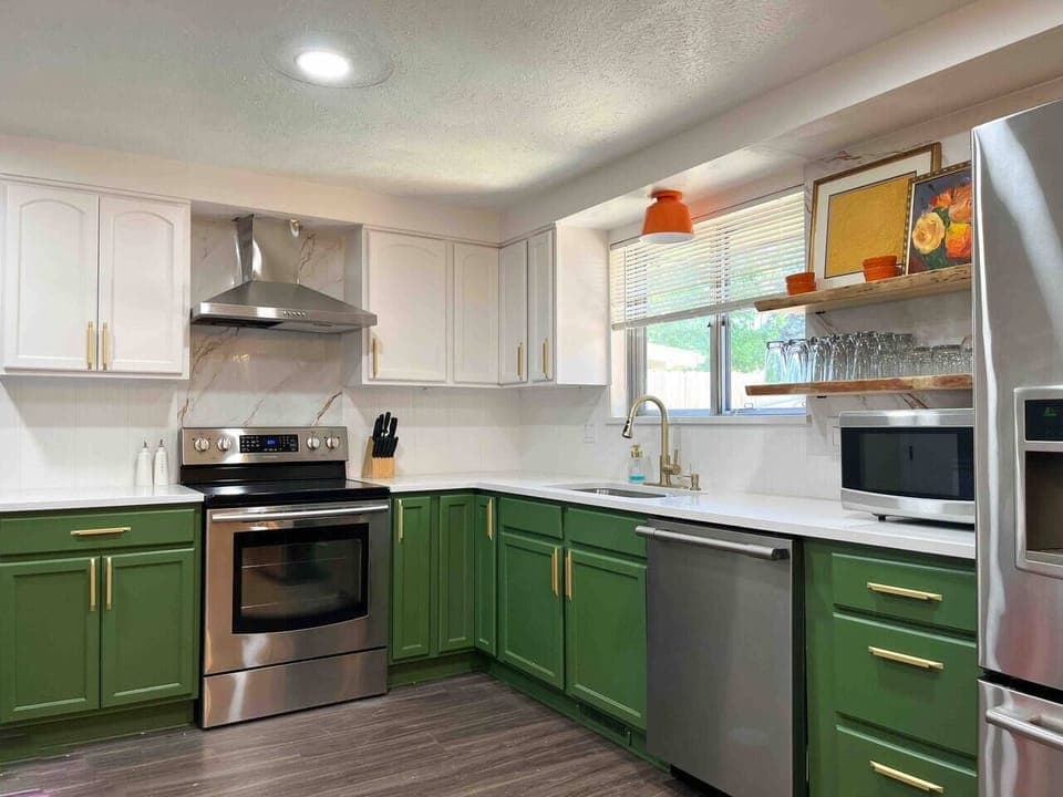 Unit 2: Kitchen is fully stocked with dishwasher and garbage disposal. Live edge shelving with plenty of glassware.