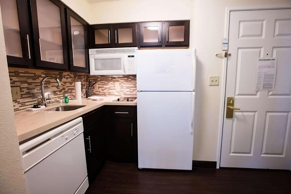 Prepare simple meals with full-size fridge, microwave, and cooktop.