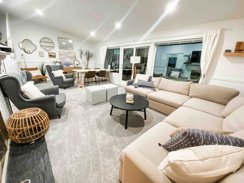 Large living and dining room overlooks to back deck and forest. 