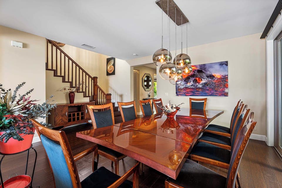 Formal dining area with custom artwork and statement lighting