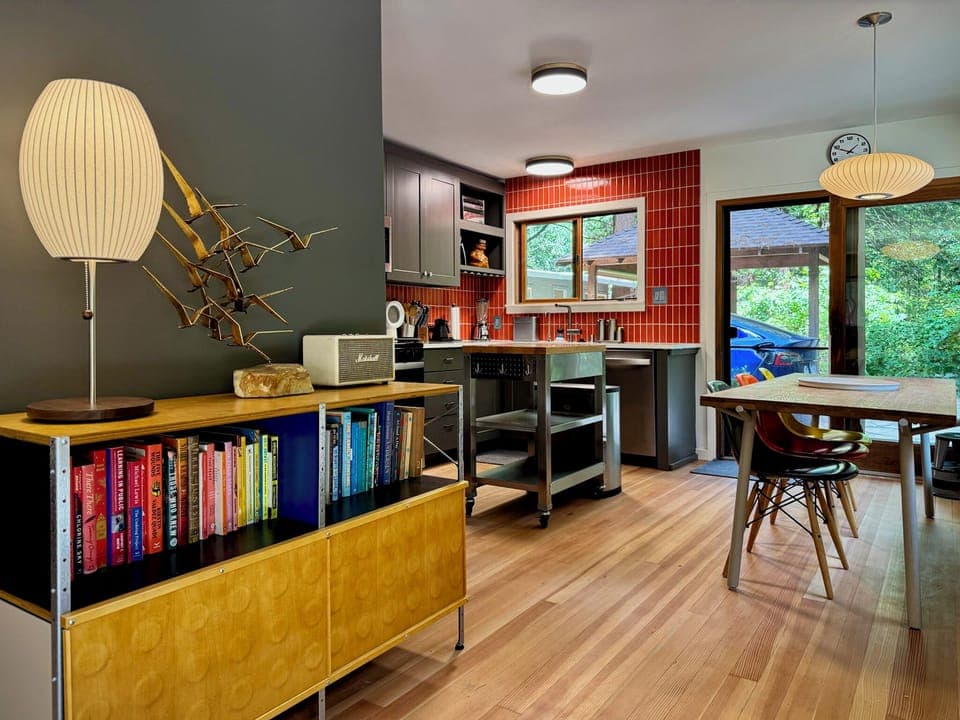 Mid-century warmth meets modern function, gather, cook, and unwind in this inviting kitchen and dining space.