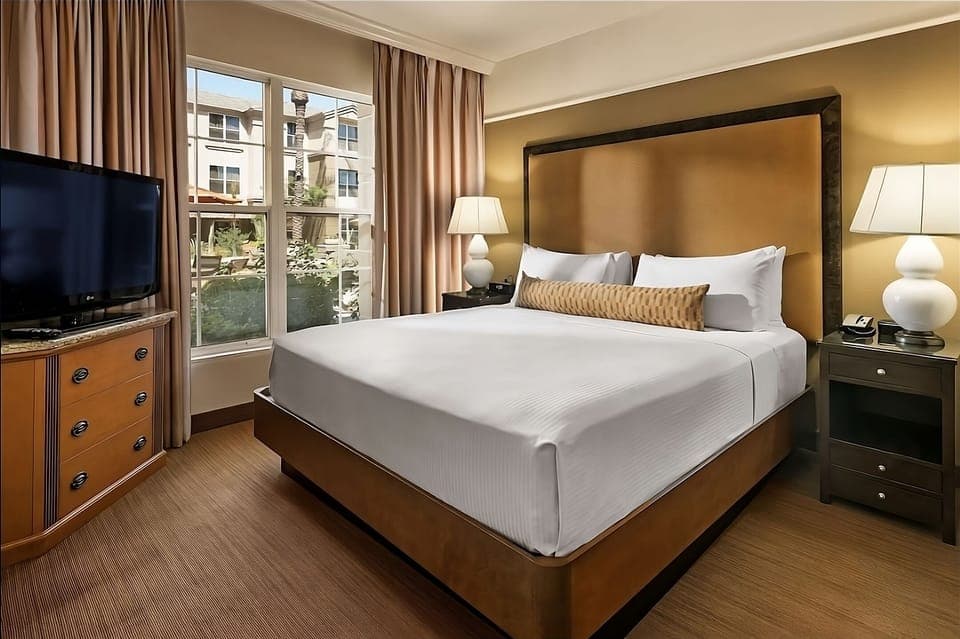 Wake up to natural light in a serene king retreat.