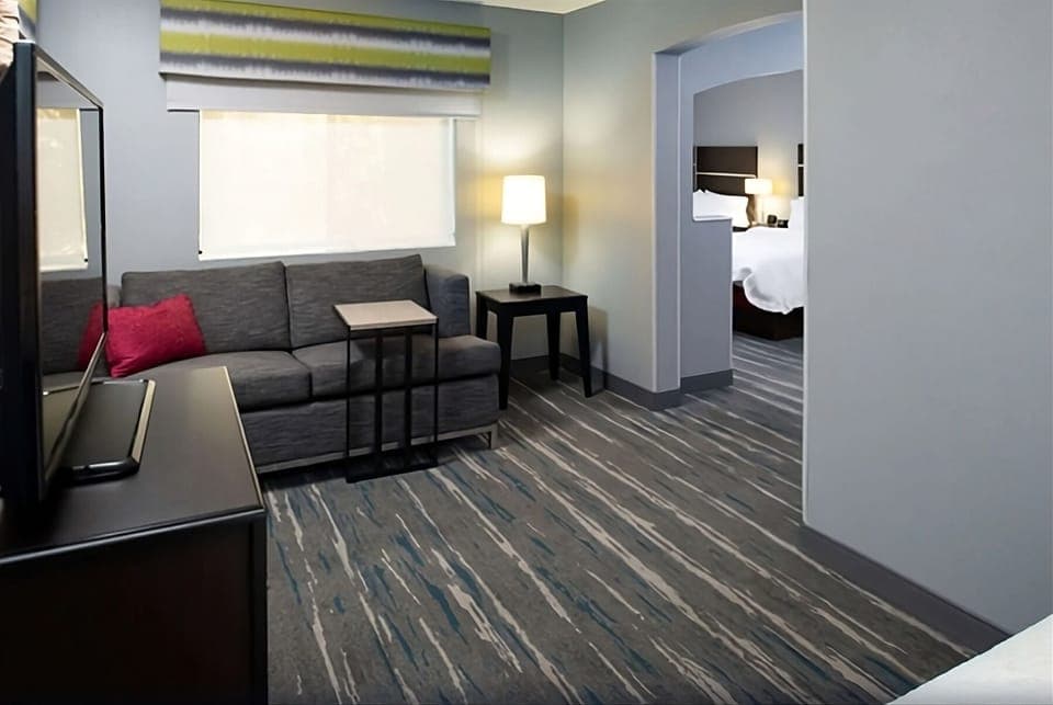 Relax in the lounge area with warm lamp-lit ambiance.