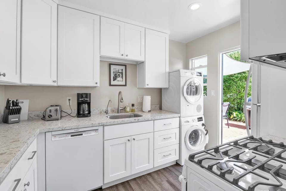Kitchen: fully stocked with washer and dryer