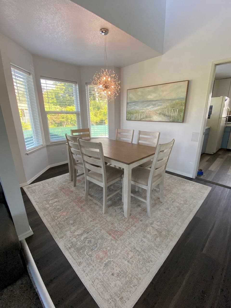 Dining room seats 6. 4 extra folding chairs in the garage, high chair in pantry.