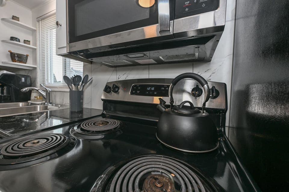 Stocked Kitchen!  Utensils, place settings, pots & pans, crock pot, basic spices