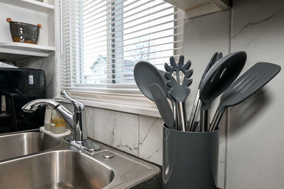 Stocked Kitchen!  Utensils, place settings, pots & pans, crock pot, basic spices