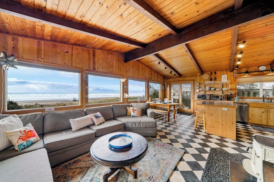 Open living area with living room, kitchen and dining area with ocean views