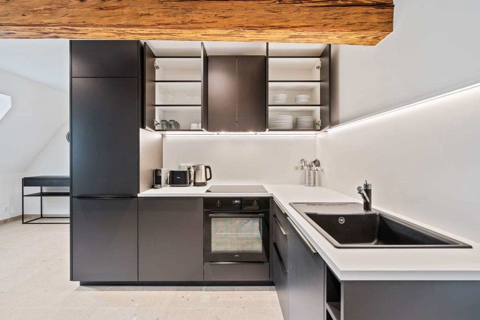 Prepare delicious meals in our sleek and modern kitchen, fully equipped with top-of-the-line appliances and ample storage space.