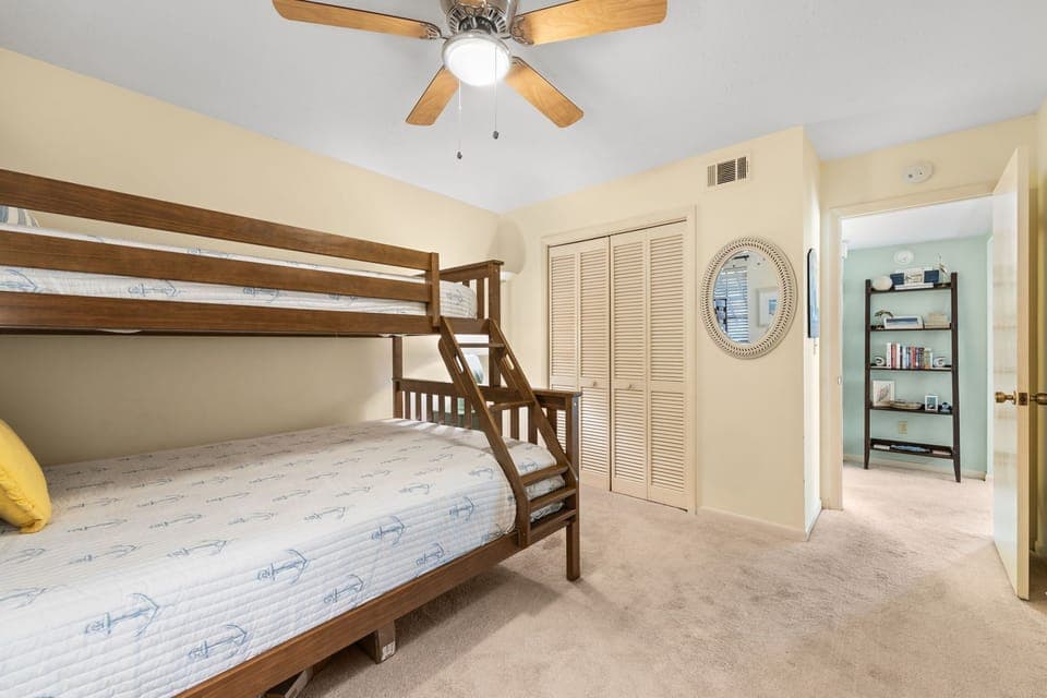 Rest peacefully in your cozy bunk room with fresh linens and gentle ceiling fan breeze keeping you comfortable all night.