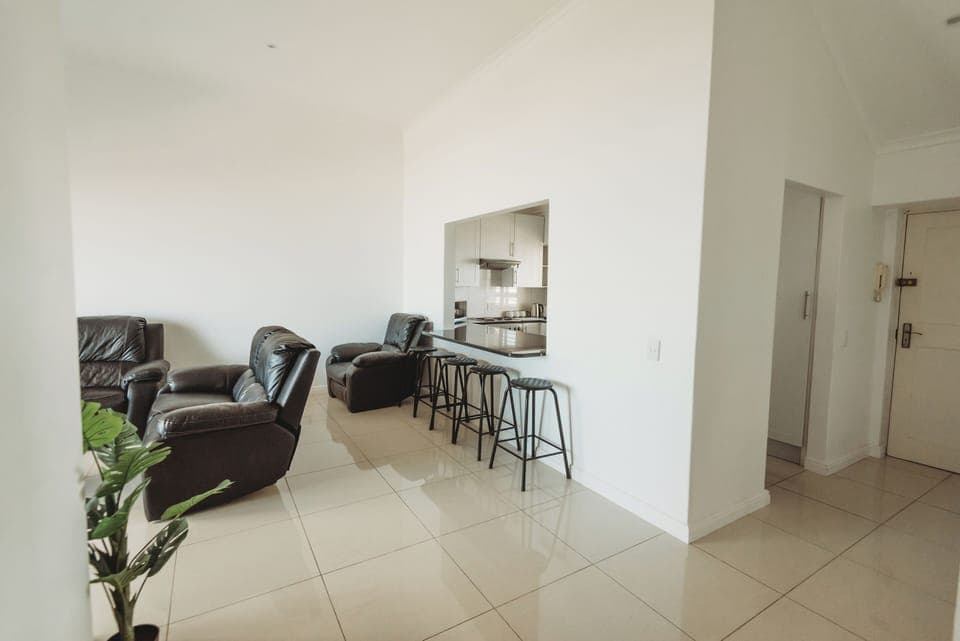Living room with kitchen access