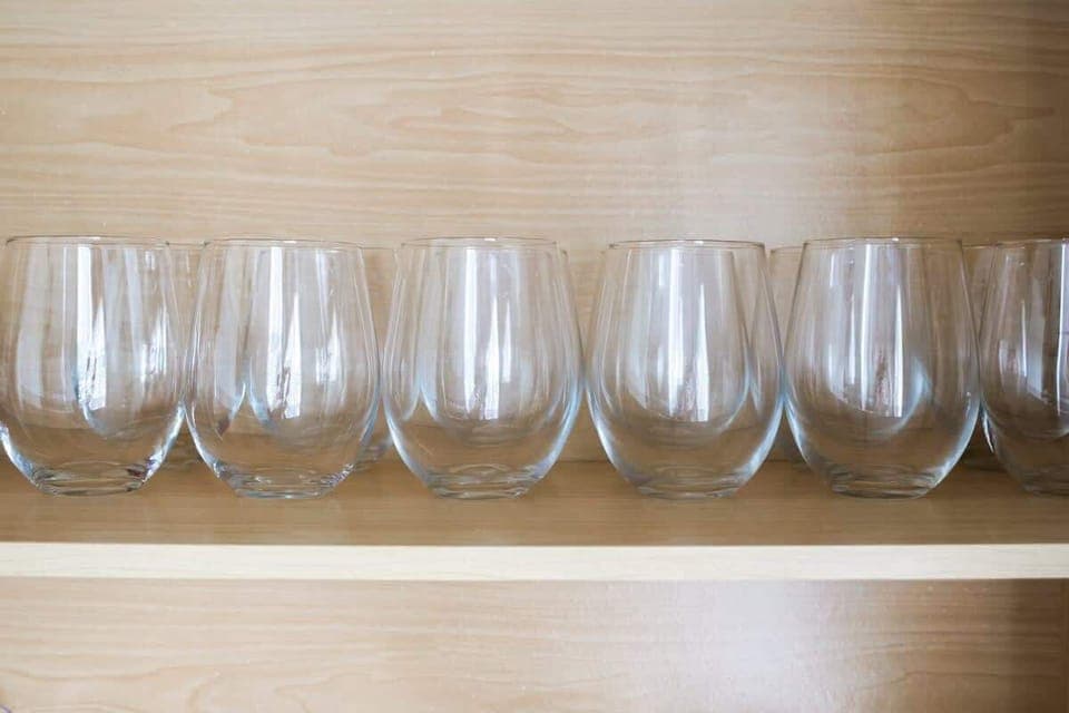 Glassware neatly arranged, ready for hosting drinks or dinner moments