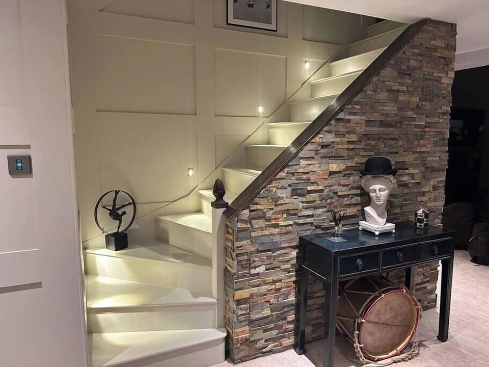 Illuminated Staircase to You Master suite and Office