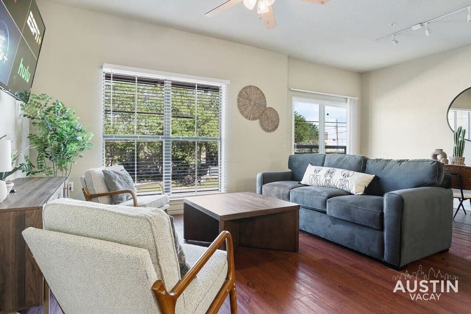 Large open living room with smart tv and dining