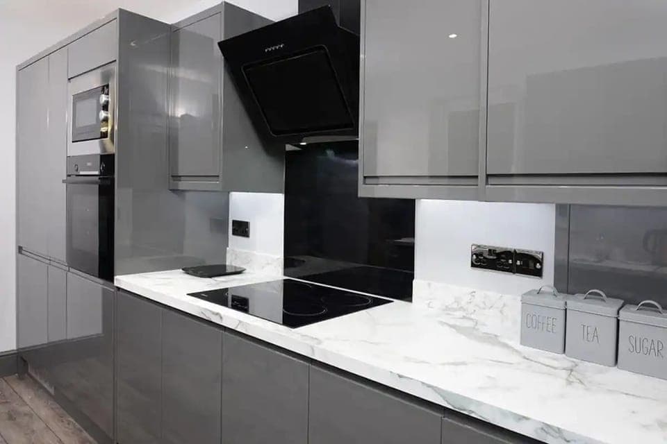 Essential appliances with white marble countertop to added touch of sophistication. 
