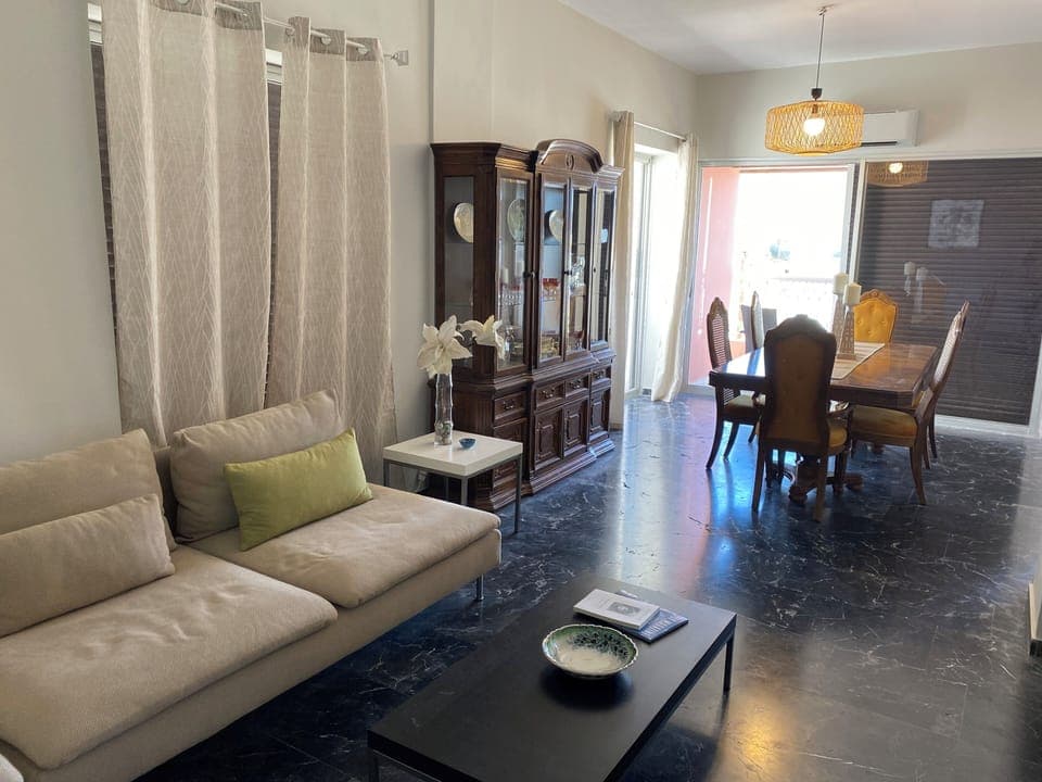 Large, open living/dining area with views of water.