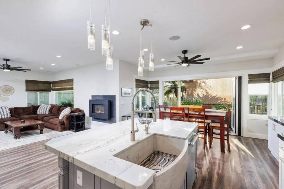 Imagine cooking in this fully remodeled Gourmet Chef's Delight Kitchen. Triple stack professional grade Thermador ovens, 6 burner stove, pot filler, and large island with extra large industrial style Farmhouse sink.  Perfect for the family cook, and 