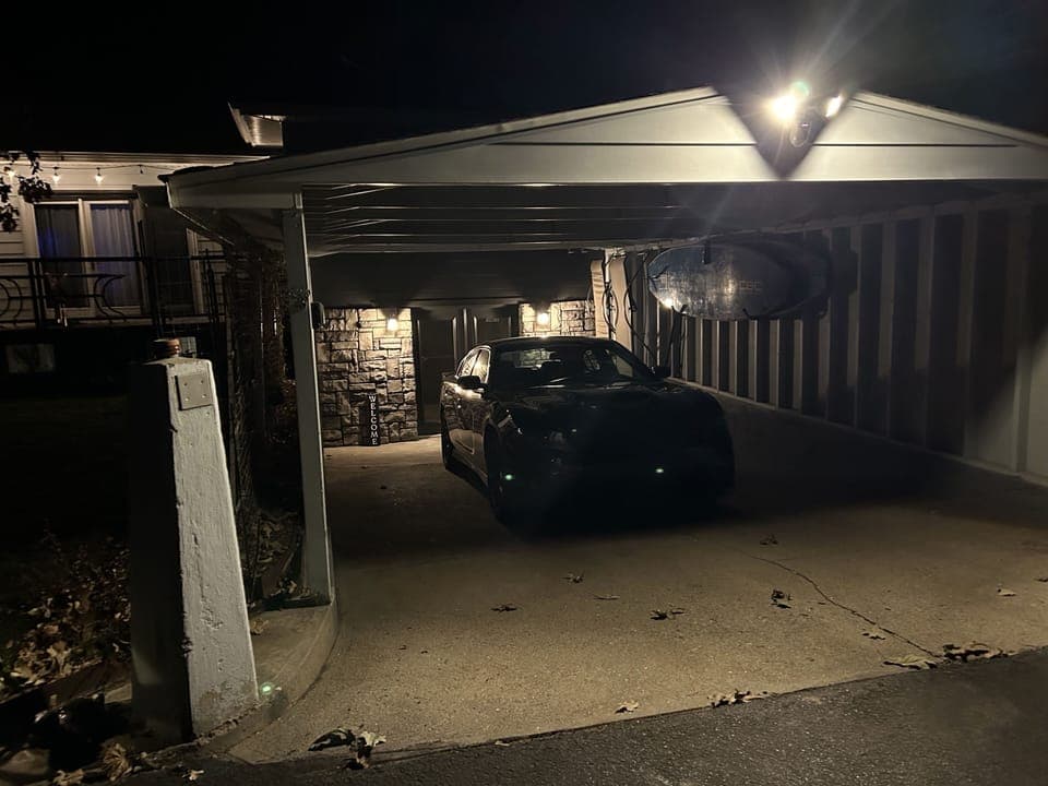 Carport has motion lights to help light your path.