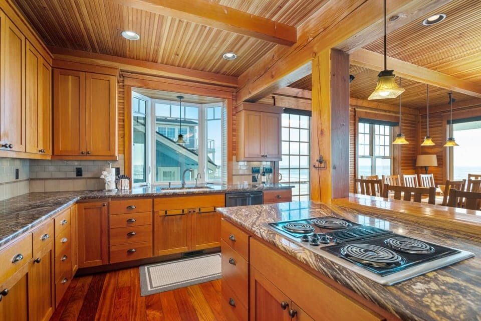 The beautifully appointed kitchen includes a double oven and an over-sized refrigerator to ease the task of cooking for a crowd.