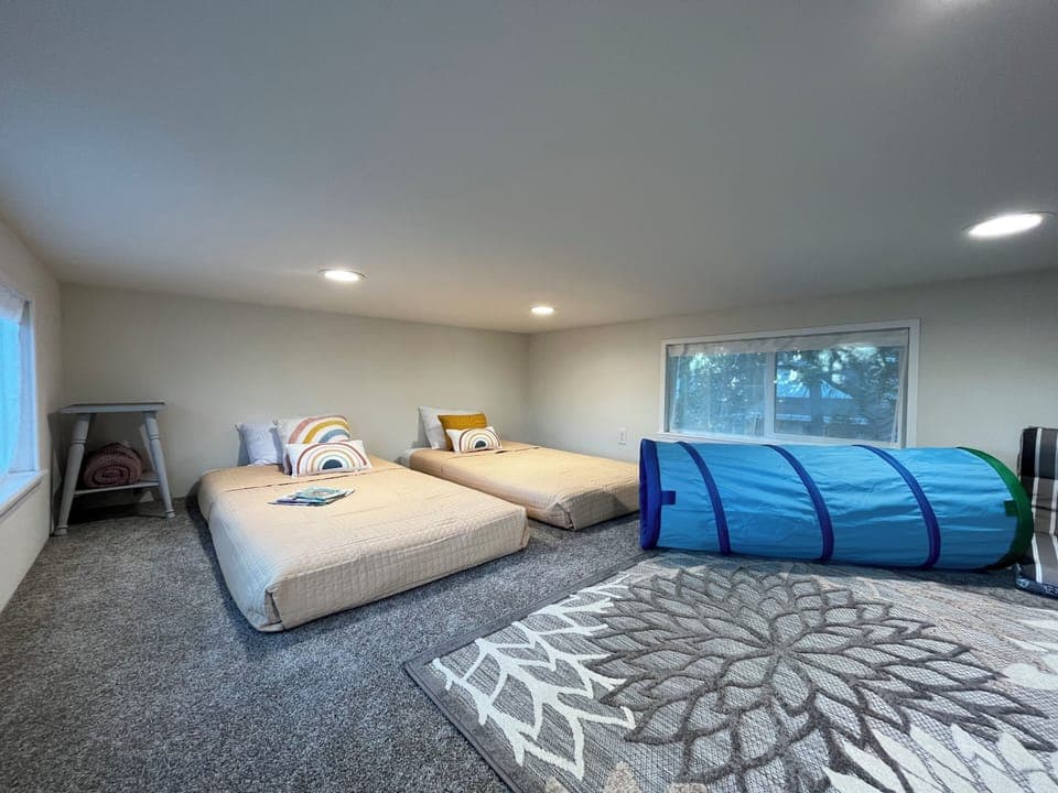 Hang out in the fun, spacious loft upstairs with 2 single beds (or one big bed)