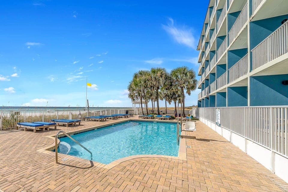 Soak up sunshine by the sparkling pool steps from sand.